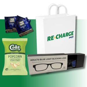 Recharge Populi branded tote bag with Sleep herbal infusion tea, blue light blocking glasses, and popcorn displayed together