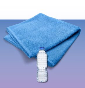 Blue towel and water bottle representing hydration and wellness essentials