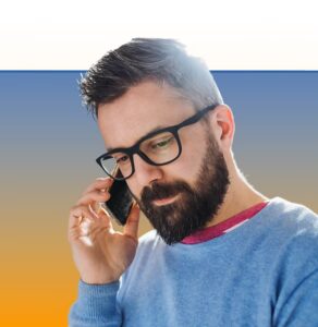 Man wearing glasses talking on a phone against a blue and yellow gradient background
