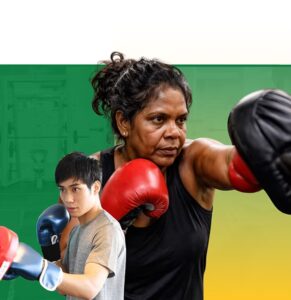 Female boxing instructor teaching young male student proper punching technique with red and blue boxing gloves