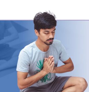 Man performing a guided breathing or meditation exercise with hands placed on chest in a calm, mindful posture