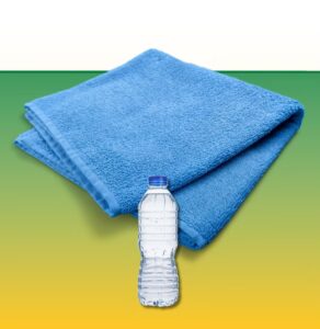 Blue towels and water bottle for workout recovery and hydration