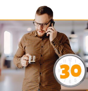 Man in glasses and checkered shirt on phone holding coffee with clock showing 30-minute duration overlay
