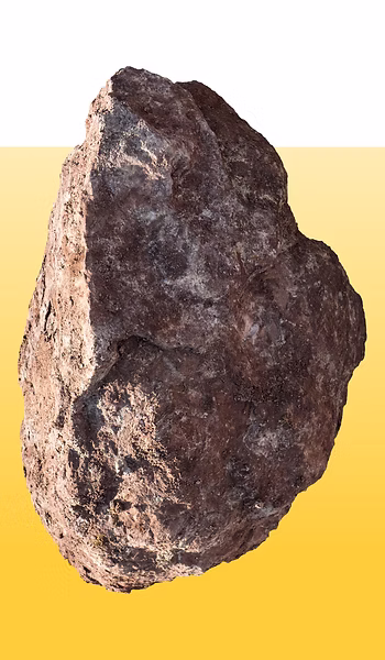 Rough textured stone against yellow background symbolizing strength and stability