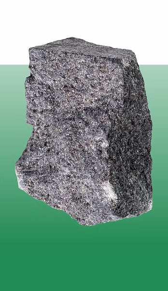 Rough gray stone block against a green background representing stability and respect as core values